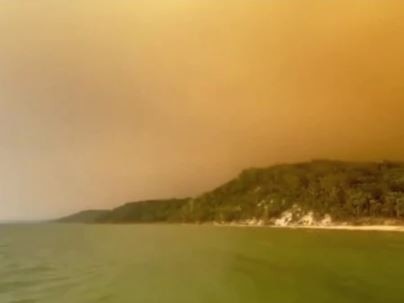 Fires continue to burn on Fraser Island, with a looming heatwave set to make conditions worse for firefighters.