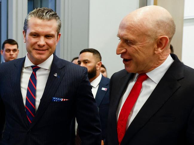 US Defense Secretary Pete Hegseth (Centre L) and British Defence Secretary John Healey react as they meet, on the eve of a NATO defence ministers' meeting at the alliance's headquarters in Brussels, on February 12, 2025. New US Secretary of Defense Pete Hegseth arrives for his first meetings at NATO headquarters on February 12 looking to push European nations over support for Ukraine and ramping up military spending. Washington's allies are waiting nervously for clarity from President Donald Trump's administration after the volatile leader demanded NATO more than double its spending target and vowed to end the war in Ukraine. (Photo by Johanna Geron / POOL / AFP)