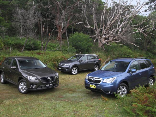 The Mazda CX-5 (left), Toyota RAV4 (centre) and Subaru Forester (right) are becoming commonplace. Picture: Joshua Dowling