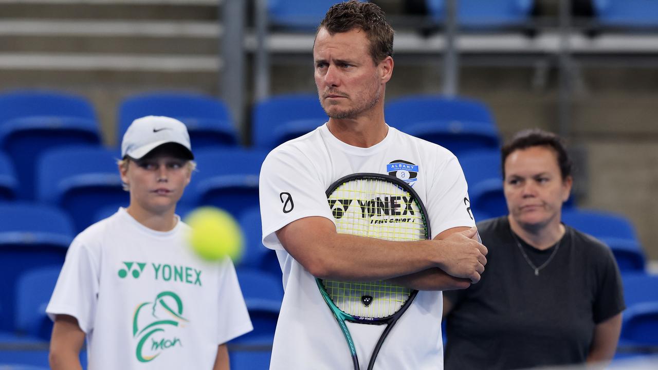 Australian ATP Cup captain Lleyton Hewitt watches a team training session alongside son Cruz (left). Picture: Getty Images