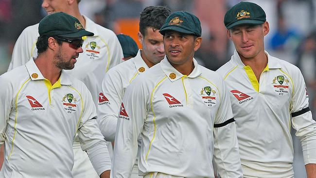 The Aussies leave the ground after the match petered out. Picture: AFP