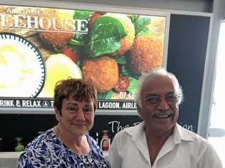 TOGETHER AT LAST: Helen Perikkentis and Miltiades Neothyton reunite at Whitsunday Coast Airport 60 years after he rescued Mrs Perikkentis from kidnappers in Cairo.