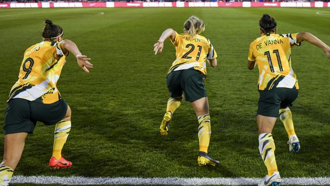 From left, Caitlin Foord #9 of Australia, Ellie Carpenter #21 and Lisa De Vanna #11 warm up before taking on the United States in Colorado. Picture: Michael Ciaglo/Getty Images