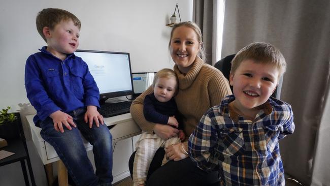 Amy Dawe at home in Young, with her children, 4-year-old Cooper, 3-year-old Archie and 1-year-old Amelia. She runs a virtual assistant business from home.