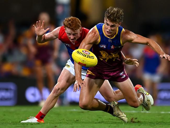 Jake Bowey of the Demons and Deven Robertson of the Lions compete for the ball during the round two AFL match between Brisbane Lions and Melbourne Demons at The Gabba, on March 24, 2023, in Brisbane, Australia. (Photo by Albert Perez/AFL Photos via Getty Images)