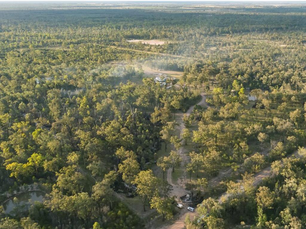 An aerial image of the Train’s property with smoke still lingering in the air from when the trio set bushfires to try and flush Constable Keely Brough out of hiding.