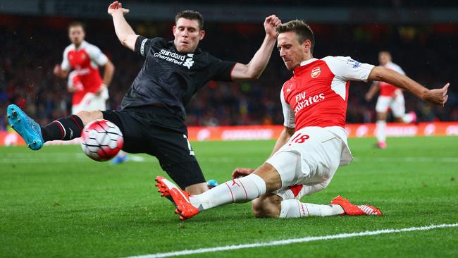 LONDON, ENGLAND - AUGUST 24: Nacho Monreal of Arsenal is closed down by James Milner of Liverpool during the Barclays Premier League match between Arsenal and Liverpool at Emirates Stadium on August 24, 2015 in London, England. (Photo by Clive Mason/Getty Images)