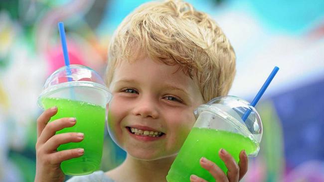 Alex Bayntun,5, shows one way to keep cool in this hot humid weather but it requires two slushies from your parents Tropical Island slushie machine.Photo: Robyne Cuerel / Fraser Coast Chronicle. Picture: Robyne Cuerel