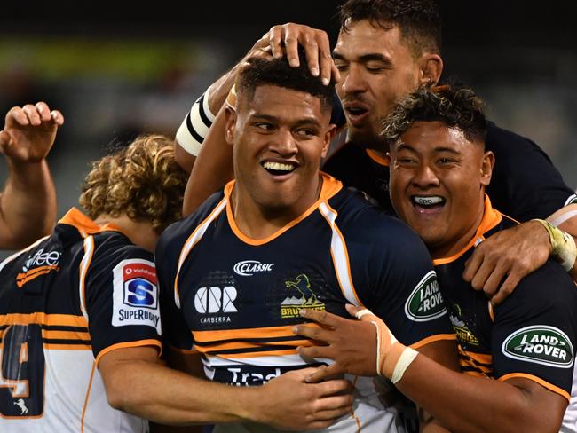 Rob Valentini of the Brumbies (centre) celebrates after scoring a try during the Round 13 Super Rugby match between the Brumbies and the Melbourne Rebels at GIO Stadium in Canberra, Saturday, May 12, 2018. (AAP Image/Mick Tsikas) NO ARCHIVING, EDITORIAL USE ONLY