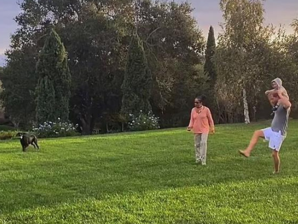 Prince Harry plays football with his mother-in-law Doria Ragland and son Archie on his shoulders. Picture: Netflix