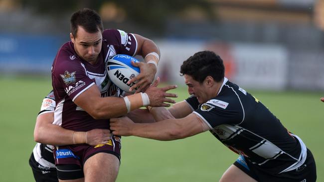 Kalani Going tries to stop Hayden Schwass. Picture: Steve Holland