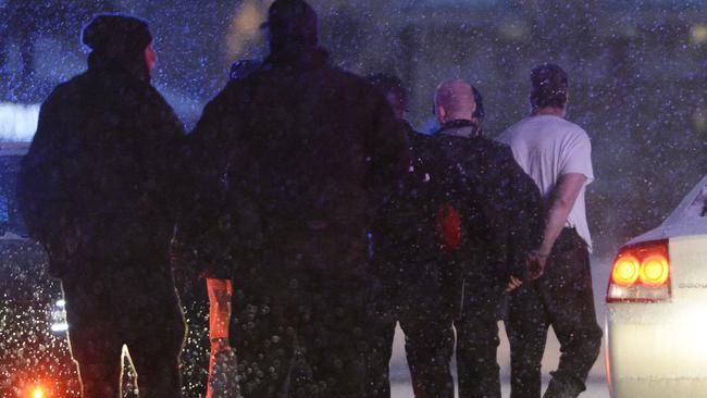 Under arrest ... Police take a man into custody near the Planned Parenthood clinic. Picture: Andy Cross/The Denver Post via AP
