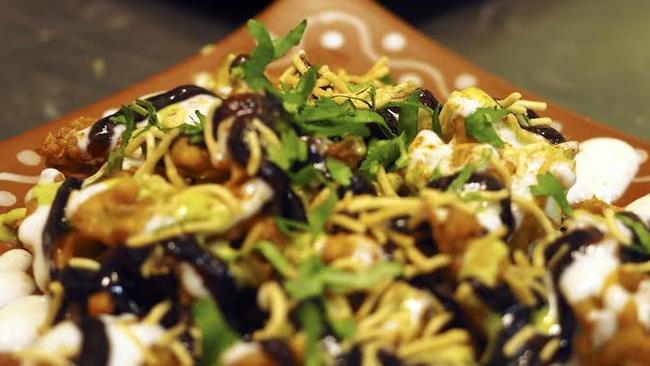 Kashi’s popular entree Bhaji Chaat are onion fritters topped with homemade mint chutney, spiced yoghurt and date and tamarind chutney. Picture: Kashi Indian Restaurant