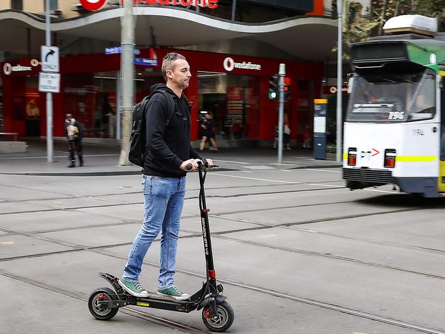 Another e-scooter rider not wearing a helmet. Picture: Ian Currie