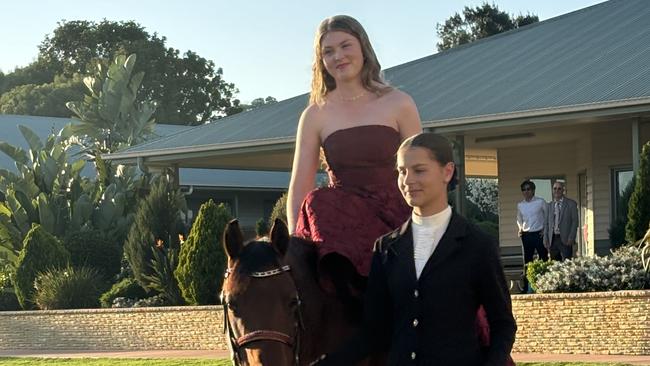 Maggie Livett arrives at Kingaroy's St John's Lutheran School formal on horseback.