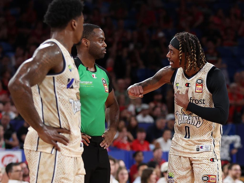 Cairns captain Tahjere McCall speaks with referee Ken Widgeon. Picture: Getty Images