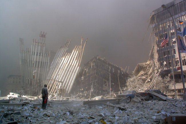 This iconic image from September 11, 2001 shows a man holding a small fire extinguisher, standing in the rubble, and calling out asking if anyone needs help, after the collapse of the first World Trade Centre Tower in New York City. AFP