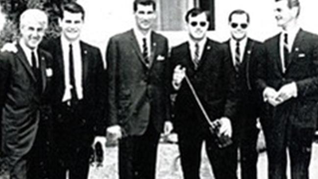 Detective Henderson (left) and Detective Senior Constable Tulloch (third from left) with President Lyndon B. Johnson’s US Secret Service officers, at Government House in 1966.