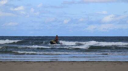 The young girl was pulled to shore by a lifeguard on a jet ski. Photo: Ian Masterman.