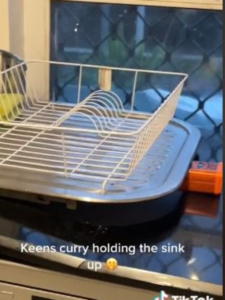 A box of Keen’s Curry power is used to hold up the sink. Picture: @dooperfiend/TikTok