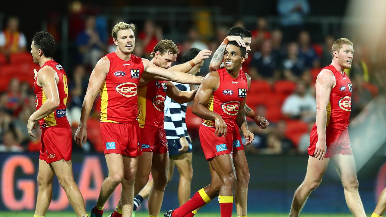 Gold Coast Suns star Touk Miller celebrates a goal with his teammates in his side’s AAMI Community Series win over Geelong Cats. Picture: Chris Hyde/Getty Images