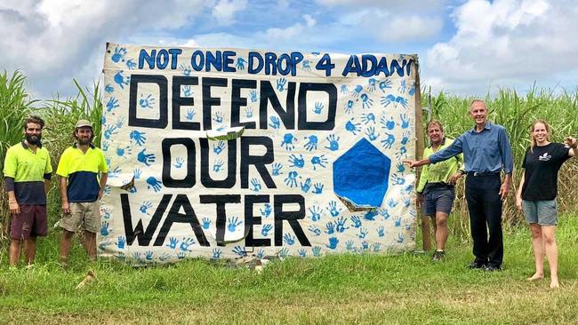 WATER: Bob Brown with cane farmer Wayne Borellini to his left in front of the Defend our Water sign. Picture: Contributed