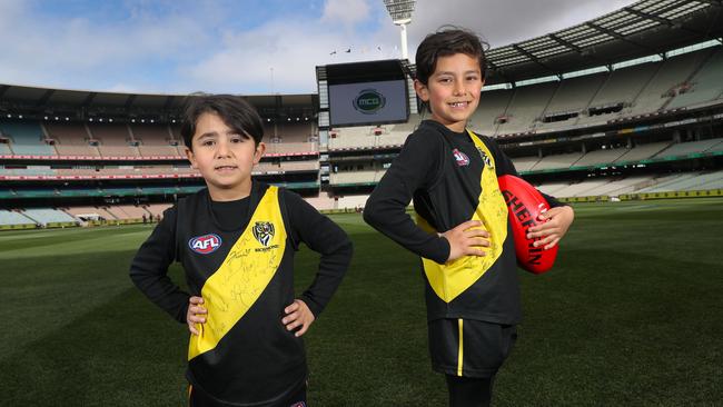 Abdulrauf, 6, and Zahariyya, 5, inspect the MCG ahead of the big game.