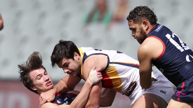 Darcy Fogarty pushes aside Norwood’s Josh Richards with Dom Barry coming in to help. Picture SARAH REED