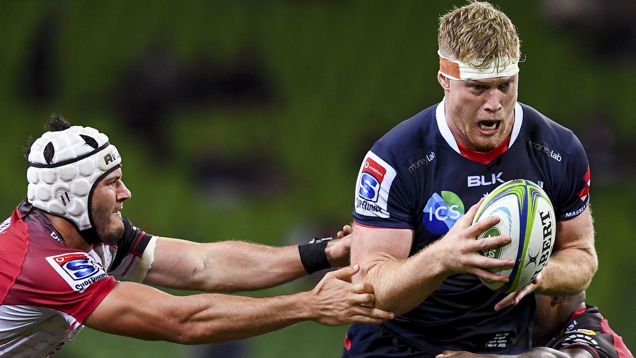 Rebels player Matt Philip attempts to break through the Lions defence.