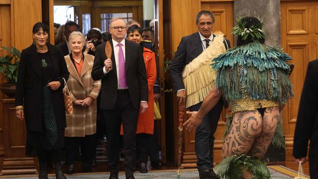 Anthony Albanese is guided by Maori cultural adviser Kura Moeahu as he takes part in a Maori welcome ceremony at parliament in Wellington. Picture: AFP