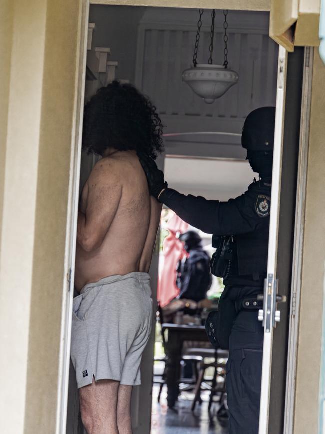 Police arrested eight men and executed multiple search warrants.