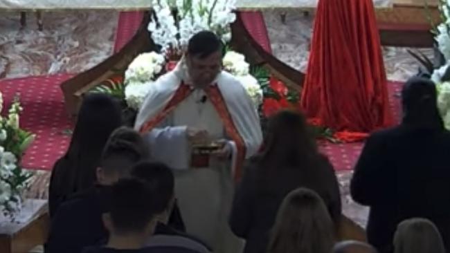 Parishioners line up closely at Our Lady of Lebanon Co-Cathedral. Picture: YouTube