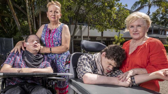 Patricia Dear and her son Kieran and Julie O'Connor with her son Rory at the Halwyn Centre, a specialist disability home for 39 people which the Queensland Government has told families will close in November. Picture: Glenn Hunt/The Australian