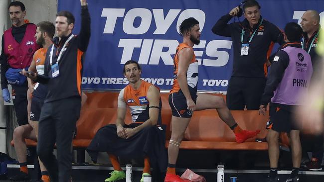 Injured Giants Phil Davis and Zac Williams watch on from the bench during Round 4.