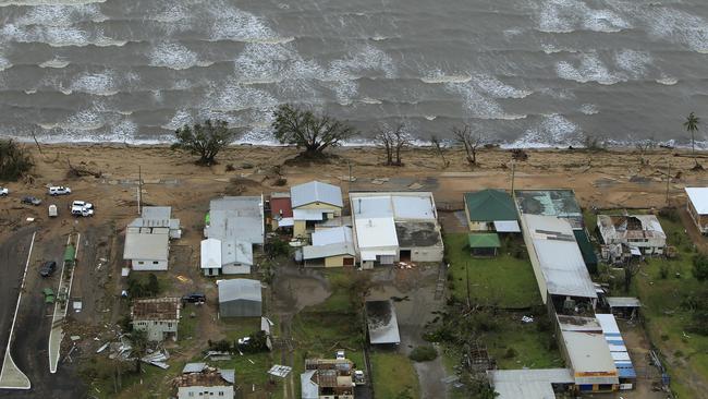 The aftermath of cyclone Yasi as it crossed the Far North Queensland coast in 2011. The Bruce Highway in Cardwell now resembles a beach track. Picture: Marc McCormack