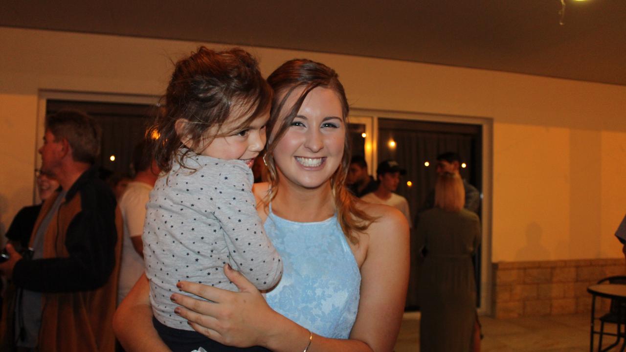 Katie Lane poses with one of her 'fans' at the St John's Formal in Roma.