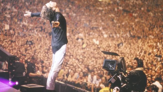 AN iconic moment: Michael Hutchence soaks up the high of an adoring crowd when INXS played Wembley Stadium in 1991.