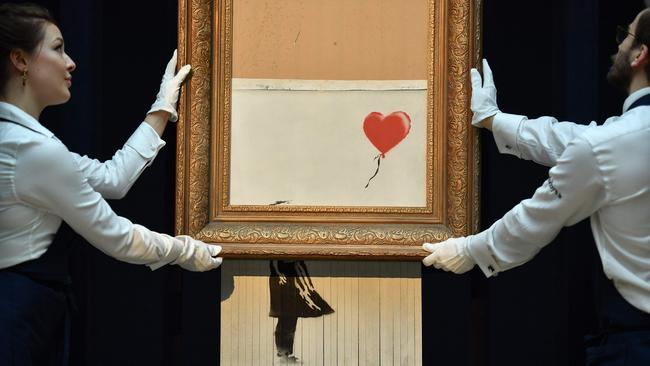 Banksy is known for political works such as Love is in the Bin, which lampooned the art trade by self-destructing after it was sold at auction. Picture: AFP