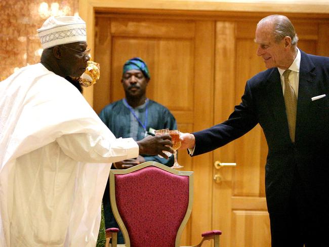 Nigerian President Olusegun Obasanjo toasts with Prince Philip at the State House in Abuja in December 2003. Picture: AFP