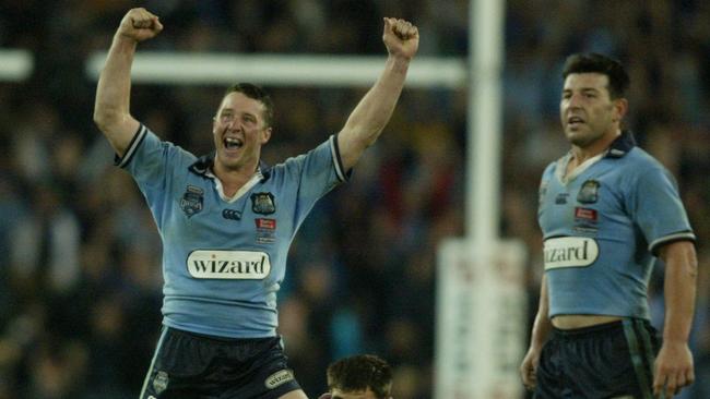 Shaun Timmins celebrates after kicking the winning field goal in extra-time in 2004.