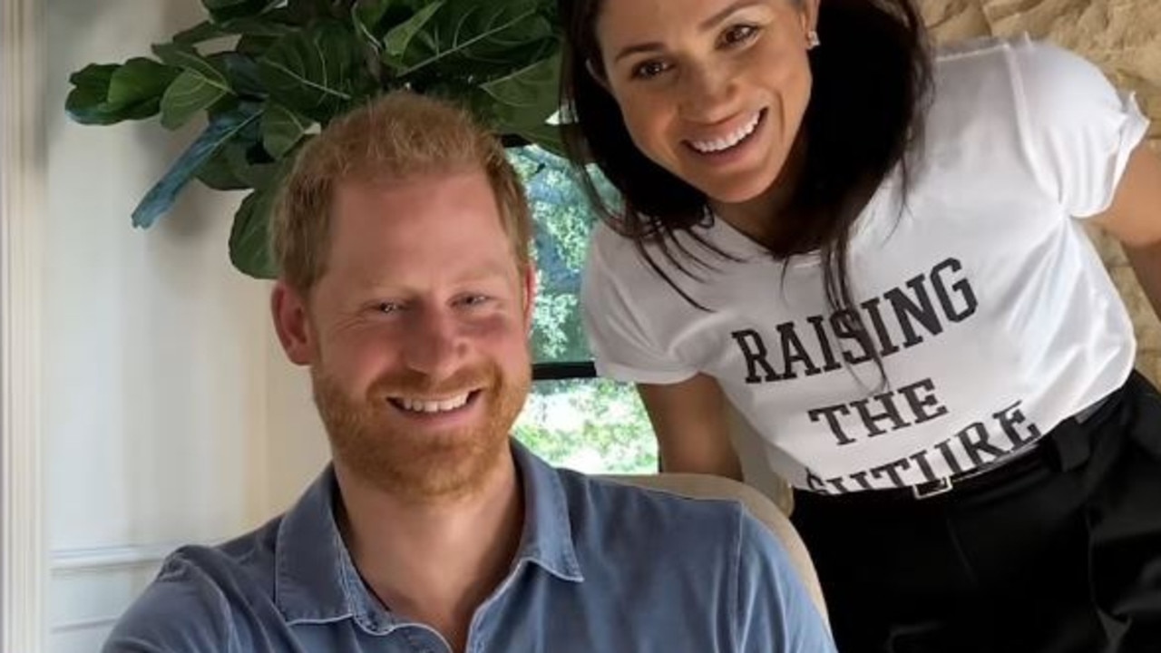 During the documentary, Meghan Markle is seen looking over Prince Harry's shoulder. Picture: Supplied