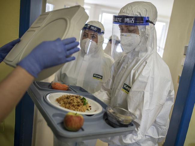 Healthcare workers serve lunch to patients in the COVID-19 ward at Hospital Karvina-Raj in Karvina, Czech Republic. Picture: Getty Images