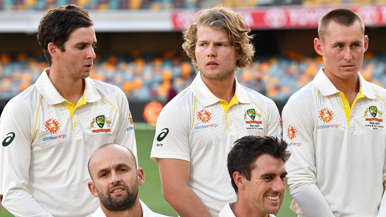 Will Pucovski (centre) of Australia poses next to Jhye Richardson and Marnus Labuschagne.