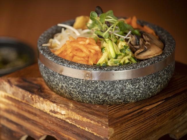 Lazy Brunch’s traditional Korean offering, bibimbap, is a mixed-rice dish, served in a heated stone bowl which features a selection of pan-fried tofu, pickled radish, mushrooms, carrot and zucchini. Picture: Chris Kidd