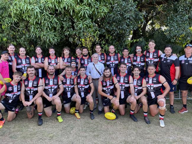 North Mackay Saints founder Frank Zeolla (centre) was tasked with presenting the Saints with the premiership trophy. Picture: Supplied.