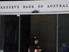 A pedestrian walks into the Reserve Bank of Australia