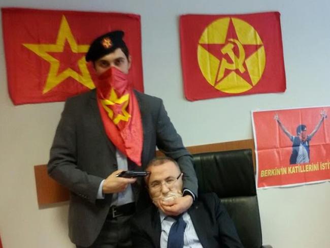 Shared on social media ... a controversial photo of a militant holding a gun to the head of prosecutor Mehmet Selim Kiraz in Istanbul on March 31, 2015. Picture: AFP