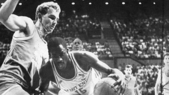 Basketballer Al Green tries to force his way past Larry Sengstock during a match between the Adelaide 36ers and the Brisbane Bullets in October, 1986.