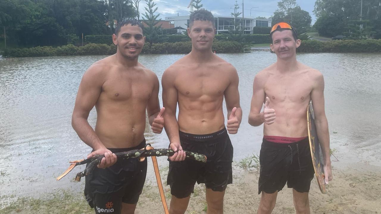 Left to right: Tallis Murray, Mark Antonie, and Hayden Eales took advantage of the wild weather by using a makeshift ski on the flooded Seafront Oval. Picture: Phillip Fynes-Clinton