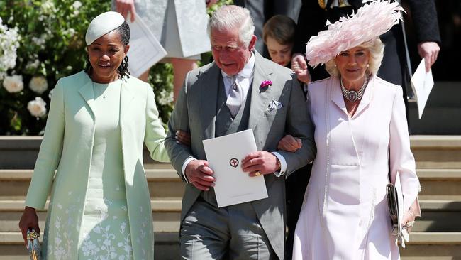 Meghan Markle's mother Doria Ragland, left, was given the same billing as Prince Charles. Picture: AFP